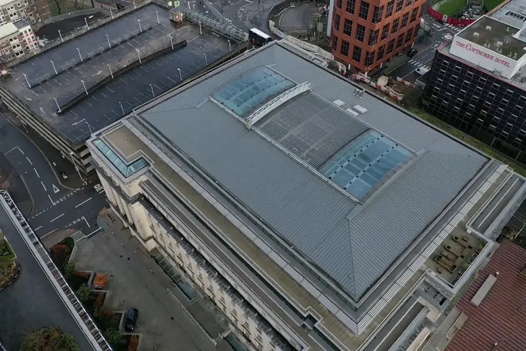 Aerial view of an industrial roof being surveyed